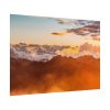 Clouds Envelope a Mountain Range During Sunset Poster