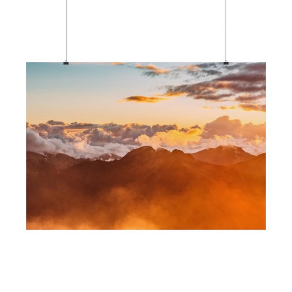 Clouds Envelope a Mountain Range During Sunset Poster