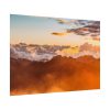 Clouds Envelope a Mountain Range During Sunset Poster