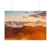 Clouds Envelope a Mountain Range During Sunset Poster