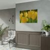 Yellow Tulips Blooming in the Field Poster