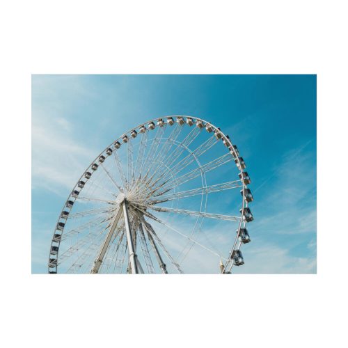 Large Ferris Wheel Against a Blue Sky Poster