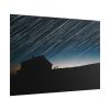 101875-86.jpg Long Exposure of the Star Trails Above the Barn Poster