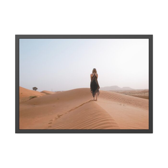 Woman Walking on Sandy Deserts Framed Poster - Image 1