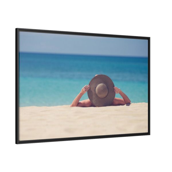 Woman Wearing a Hat on the Beach Framed Canvas