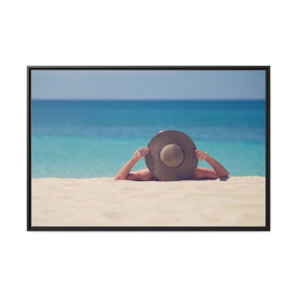Woman Wearing a Hat on the Beach Framed Canvas