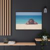 Woman Wearing a Hat on the Beach Framed Canvas