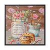 Baked Cakes on a Counter With a Vintage Wood Framed Canvas