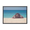 Woman Wearing a Hat on the Beach Framed Poster