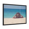 Woman Wearing a Hat on the Beach Framed Poster