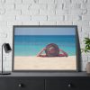 Woman Wearing a Hat on the Beach Framed Poster