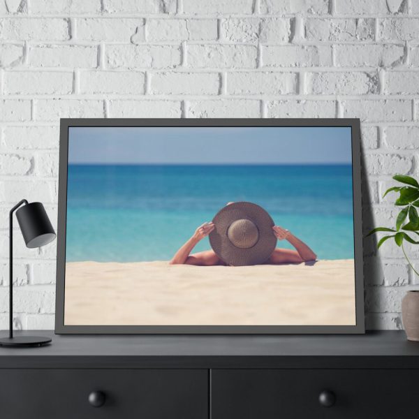 Woman Wearing a Hat on the Beach Framed Poster