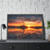 Lighthouse With a Sunset View Framed Poster